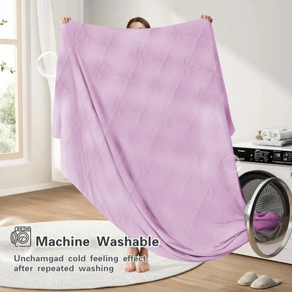 VelmoraMart cooling comforter draped over a bed, showcasing breathable, temperature-regulating fabric for hot sleepers.