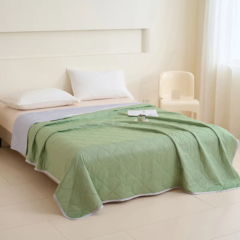 VelmoraMart cooling comforter draped over a bed, showcasing breathable, temperature-regulating fabric for hot sleepers.
