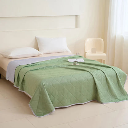 VelmoraMart cooling comforter draped over a bed, showcasing breathable, temperature-regulating fabric for hot sleepers.