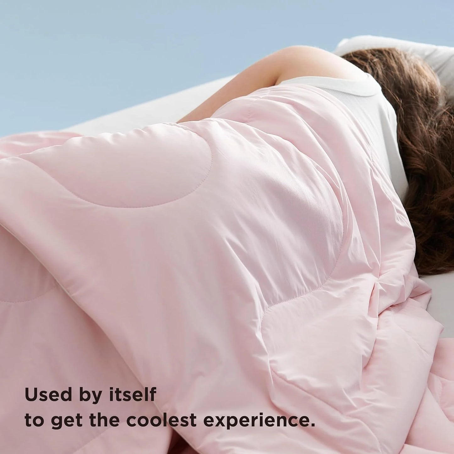 VelmoraMart cooling comforter draped over a bed, showcasing breathable, temperature-regulating fabric for hot sleepers.