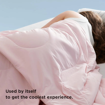 VelmoraMart cooling comforter draped over a bed, showcasing breathable, temperature-regulating fabric for hot sleepers.