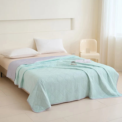 VelmoraMart cooling comforter draped over a bed, showcasing breathable, temperature-regulating fabric for hot sleepers.