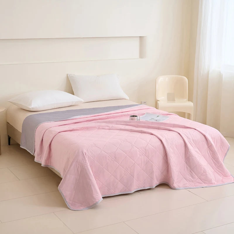 VelmoraMart cooling comforter draped over a bed, showcasing breathable, temperature-regulating fabric for hot sleepers.