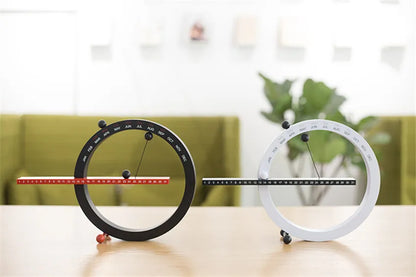 A beautiful wooden perpetual calendar displayed on a clean, minimalist office desk.