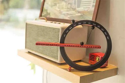 A beautiful wooden perpetual calendar displayed on a clean, minimalist office desk.