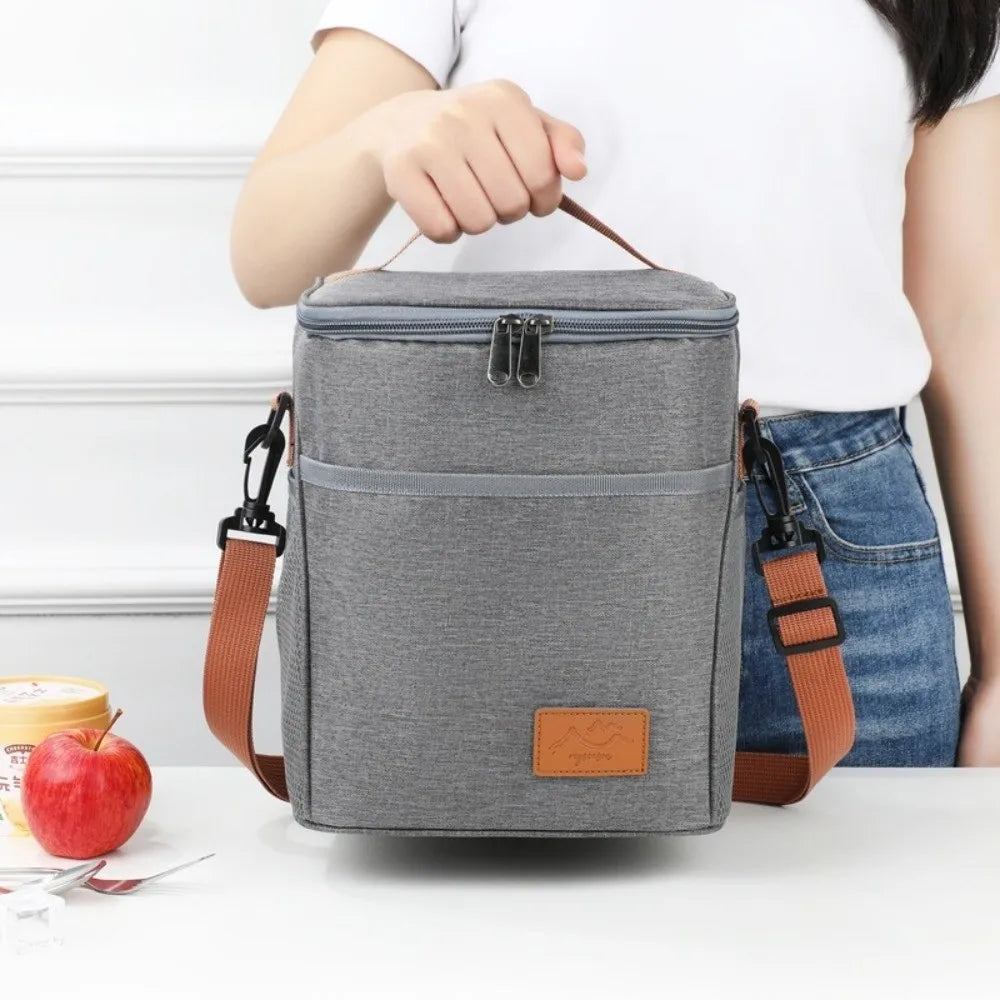 Lunch bag insulated with leakproof thermal lining, spacious interior, durable fabric, and stylish design for work, school, travel, and everyday meals.