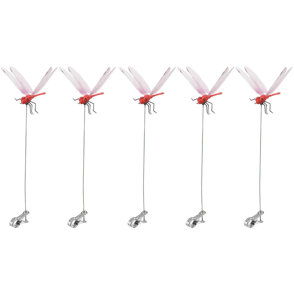 Detailed view of fake dragonfly clips on a summer hat