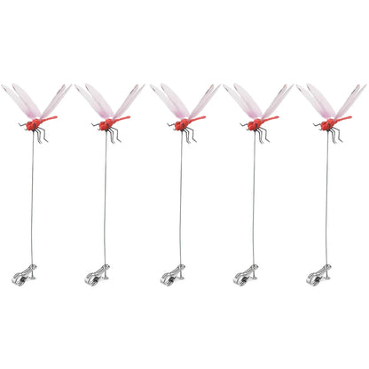 Detailed view of fake dragonfly clips on a summer hat