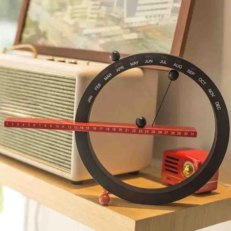 A beautiful wooden perpetual calendar displayed on a clean, minimalist office desk.
