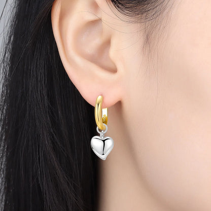 Elegant heart earrings for women featuring gold and silver heart-shaped designs, perfect for gifting and everyday fashion from VelmoraMart.
