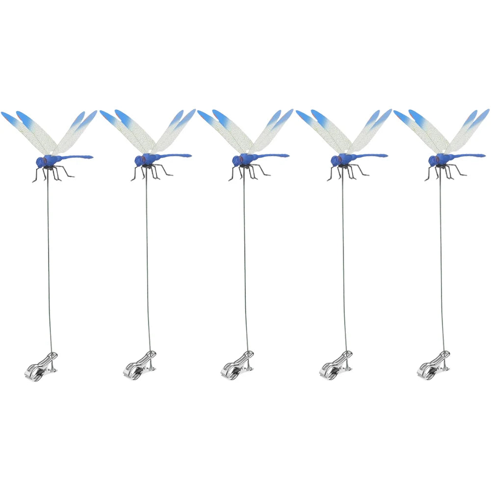 Detailed view of fake dragonfly clips on a summer hat