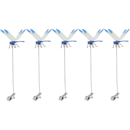 Detailed view of fake dragonfly clips on a summer hat