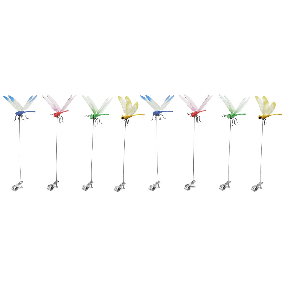 Detailed view of fake dragonfly clips on a summer hat