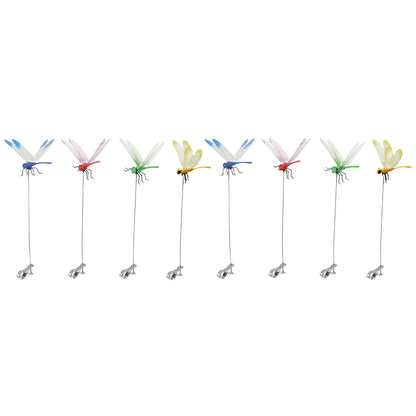 Detailed view of fake dragonfly clips on a summer hat