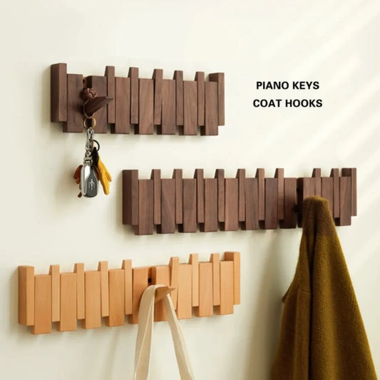 Piano shaped wall mounted wooden coat rack with hidden folding hooks for modern home organization by VelmoraMart.