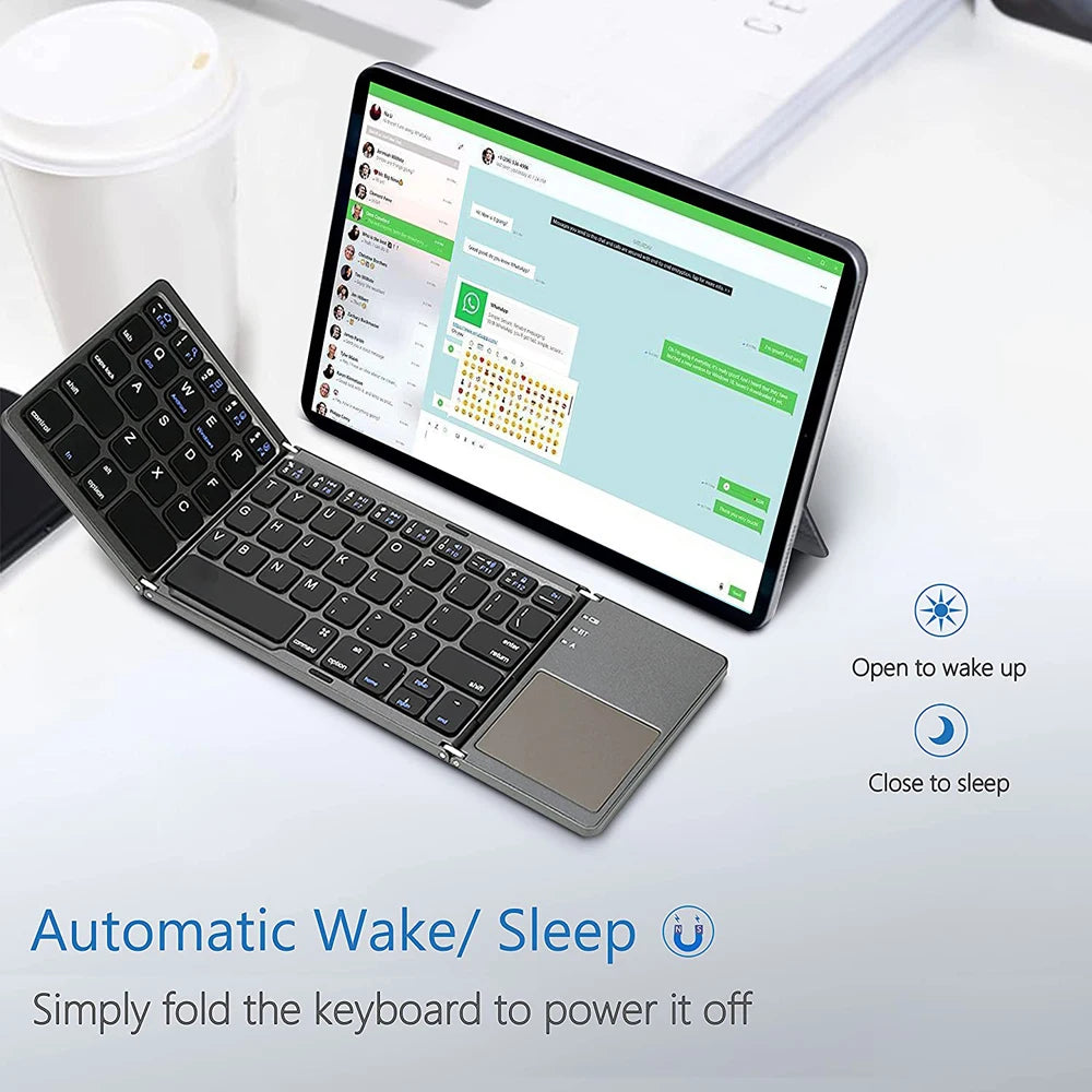 A premium foldable keyboard set up on a mobile desk for travel.