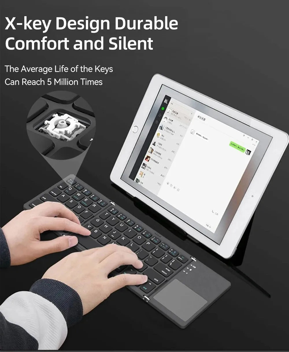 A premium foldable keyboard set up on a mobile desk for travel.