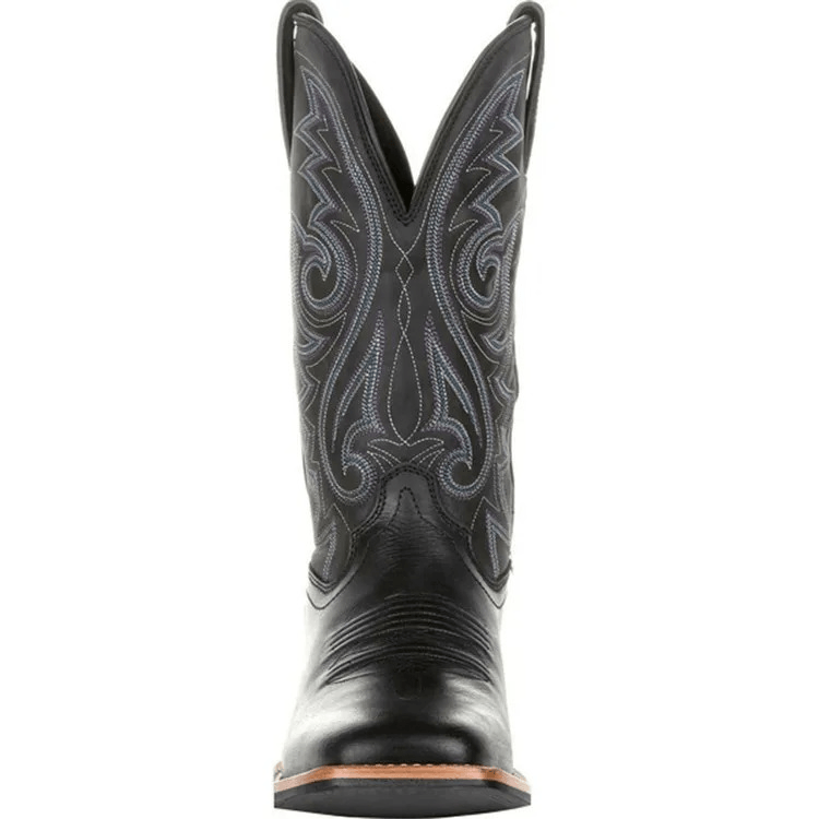 Black cowboy boot with intricate embroidery on a white background