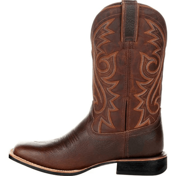 Brown cowboy boot with intricate stitching on a white background