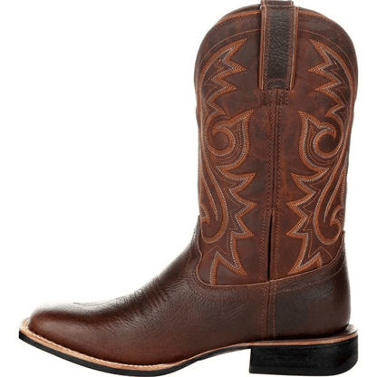 Brown cowboy boot with intricate stitching on a white background