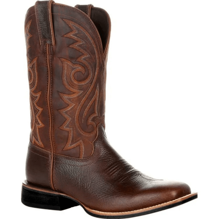 Brown cowboy boot with intricate stitching on a white background