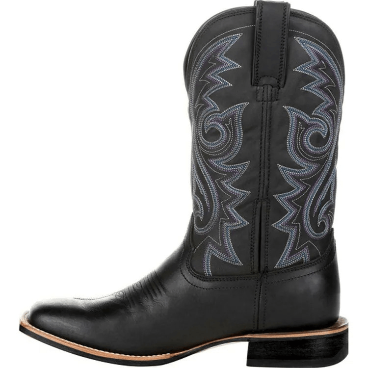 Brown cowboy boot with intricate stitching on a white background