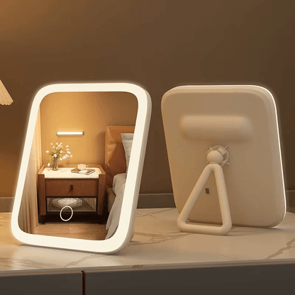Lighted vanity mirror with a wall-mounted fixture from www.velmoramart.com